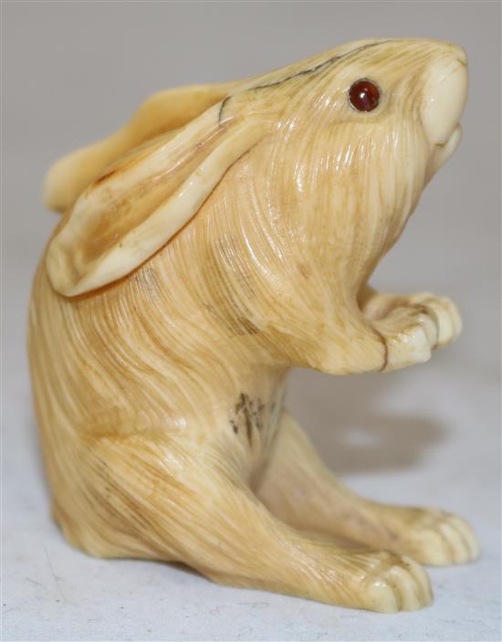 A Japanese ivory okimono of a hare, early 20th century, height 5.4cm, age cracks